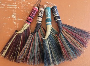 Rooster tail brooms with a herringbone twisted plait