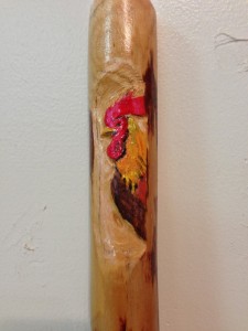 Rooster carved into the handle of a custom ordered broom